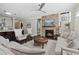 Comfortable living room with stone fireplace, neutral tones and cozy furnishings at 805 Narrative Ln, Durham, NC 27703