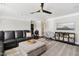 Cozy living room featuring a ceiling fan, comfortable seating, and stylish decor at 805 Narrative Ln, Durham, NC 27703