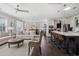 Open-concept living room and kitchen with bar seating and modern appliances at 805 Narrative Ln, Durham, NC 27703