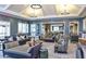 A view of the elegant lounge with comfortable seating, stylish decor, and ample lighting at 805 Narrative Ln, Durham, NC 27703