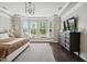 This main bedroom showcases a bay window with bench seating and decorative dresser at 805 Narrative Ln, Durham, NC 27703