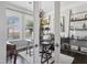 Bright office space featuring glass doors, hardwood floors, natural light, and custom shelving at 805 Narrative Ln, Durham, NC 27703