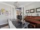 Stylish office with hardwood floors, a piano, and a modern desk setup at 805 Narrative Ln, Durham, NC 27703