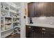 Walk-in pantry with custom shelving provides ample storage space at 805 Narrative Ln, Durham, NC 27703