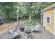 Serene backyard with a deck, fire pit, and manicured landscaping, perfect for outdoor enjoyment at 813 Burch Ave, Durham, NC 27701