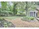 Backyard featuring an artificial turf lawn and a wooden fence at 813 Burch Ave, Durham, NC 27701
