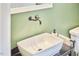 Stylish bathroom with a vessel sink, vintage faucet, and a clean, modern aesthetic at 813 Burch Ave, Durham, NC 27701