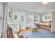 Spacious Bedroom featuring two cribs, a rocking chair, and charming decor at 813 Burch Ave, Durham, NC 27701