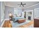 Spacious bedroom with light gray walls and hardwood flooring at 813 Burch Ave, Durham, NC 27701