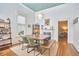 Dining room featuring a modern table, fireplace and stylish lighting at 813 Burch Ave, Durham, NC 27701