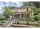 Quaint two-story home boasts a covered front porch and beautiful, mature landscaping at 813 Burch Ave, Durham, NC 27701