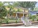 Charming two-story home with a covered front porch and well-maintained landscaping at 813 Burch Ave, Durham, NC 27701