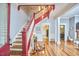 Welcoming foyer with hardwood floors, staircase, and views into the living areas at 813 Burch Ave, Durham, NC 27701