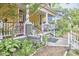 Inviting covered front porch and landscaping with concrete stairs at 813 Burch Ave, Durham, NC 27701