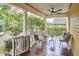 Cozy front porch with comfortable seating, ceiling fan, and classic architectural charm at 813 Burch Ave, Durham, NC 27701