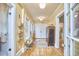 Entryway with warm wooden floors, decorative baskets, and vintage cabinet at 813 Burch Ave, Durham, NC 27701