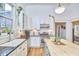 Well-lit kitchen featuring white cabinets, black countertops, subway tile backsplash and stainless steel appliances at 813 Burch Ave, Durham, NC 27701