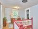 Landing featuring red and white stairs, jar pendant lights, and a view of the landing at 813 Burch Ave, Durham, NC 27701