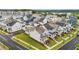 Newly built homes display manicured lawns, sidewalks, and proximity to schools and amenities at 825 Abbyberry Dr, Wake Forest, NC 27587