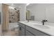 Modern bathroom with double sink vanity, tiled shower, and sleek design at 825 Abbyberry Dr, Wake Forest, NC 27587