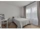 Calm bedroom featuring a bed, desk area and large window with natural light at 825 Abbyberry Dr, Wake Forest, NC 27587