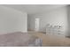 Bright bedroom featuring neutral carpet, white walls and a white dresser for ample storage at 825 Abbyberry Dr, Wake Forest, NC 27587