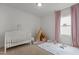 Adorable Bedroom with crib, teepee, and play area, creating a warm and inviting space at 825 Abbyberry Dr, Wake Forest, NC 27587