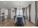 Elegant dining room showcasing a chandelier, large window, and seating for six, perfect for entertaining at 825 Abbyberry Dr, Wake Forest, NC 27587