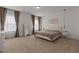 Serene main bedroom featuring two windows, soft carpet, and modern fixtures at 825 Abbyberry Dr, Wake Forest, NC 27587