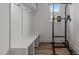 Convenient mud room with bench, storage, and natural light for organization at 825 Abbyberry Dr, Wake Forest, NC 27587