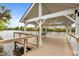 Picturesque lake view from inside a wooden pavilion, featuring railings for safety at 825 Abbyberry Dr, Wake Forest, NC 27587