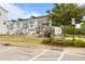 Community playground with slides, climbing structures, and seating area near townhome apartments at 825 Abbyberry Dr, Wake Forest, NC 27587