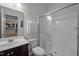 Bathroom features a white shower and neutral vanity at 831 Poplar St, Durham, NC 27703