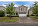 Charming two-story home with a two car garage, manicured lawn and beautiful, mature landscaping at 831 Poplar St, Durham, NC 27703