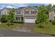 Charming two-story home featuring a well-manicured front yard and a spacious two-car garage at 831 Poplar St, Durham, NC 27703