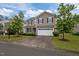 Charming two-story home with a two car garage, manicured lawn and beautiful, mature landscaping at 831 Poplar St, Durham, NC 27703
