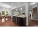 Open concept kitchen includes stainless dishwasher and view to the dining area at 831 Poplar St, Durham, NC 27703