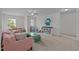 Spacious living room with sofa, table, and large windows at 831 Poplar St, Durham, NC 27703