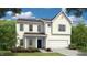 Charming two-story home with a white exterior, landscaped yard, and a welcoming front entrance at 86 Oak Meadow Ln, Angier, NC 27501
