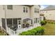 Aerial view of the home's backyard featuring a deck, screened porch, and lawn at 9013 Dansforeshire Way, Wake Forest, NC 27587