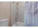 Updated bathroom with tile surround shower and tub with a marble shower curtain at 9013 Dansforeshire Way, Wake Forest, NC 27587