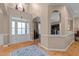 Bright foyer with hardwood floors, arched doorways, and a view into other rooms at 9013 Dansforeshire Way, Wake Forest, NC 27587