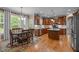 Updated kitchen with wooden cabinets, modern appliances, large center island, and breakfast nook at 9013 Dansforeshire Way, Wake Forest, NC 27587