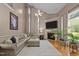 Comfortable living room with vaulted ceiling, fireplace, neutral decor, and hardwood flooring at 9013 Dansforeshire Way, Wake Forest, NC 27587