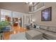 Open-concept living room with hardwood floors and seamless flow to the kitchen at 9013 Dansforeshire Way, Wake Forest, NC 27587