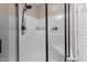 A sleek walk-in shower features a modern shower head and built-in bench seating at 9013 Dansforeshire Way, Wake Forest, NC 27587