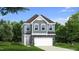 Charming two-story home with stone accents, attached two-car garage, and well-manicured lawn at 1001 Shovelhead Dr # 1, Durham, NC 27703