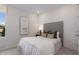 Cozy bedroom with cushioned headboard and bright window at 1004 Sora Way, Durham, NC 27703