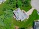 Aerial view of the home featuring a beautiful backyard, patio, and carefully designed landscaping at 102 Lions Mouth Ct, Cary, NC 27518