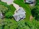 Bird's eye view of the house highlighting the roof, landscaping, and driveway from above at 102 Lions Mouth Ct, Cary, NC 27518
